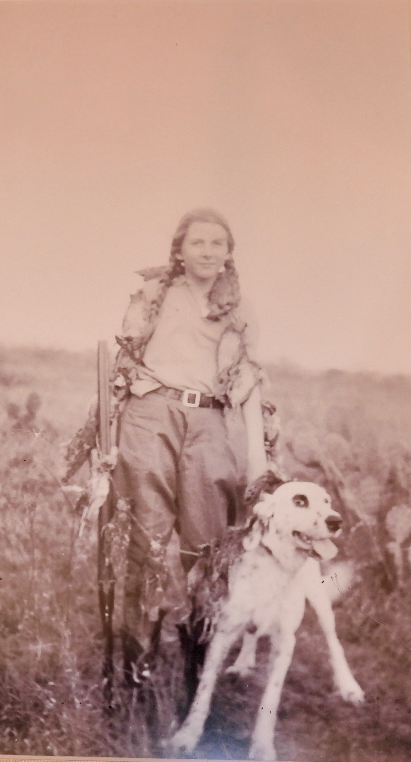 Lica and one of her dogs returning from a bird hunt.